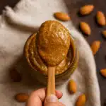 Moroccan Sweet Almond Paste Made With Honey And Argan Oil 8 Creamy sweet almond paste made with honey and argan oil in a glass jar, surrounded by whole almonds