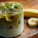 Banana Bread Matcha – The Viral Drink You’ll Want Every Morning 3 Banana bread matcha latte in clear glass with foam and cinnamon