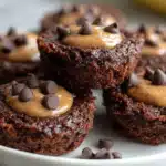 flourless chocolate protein brownie bites stacked on a plate