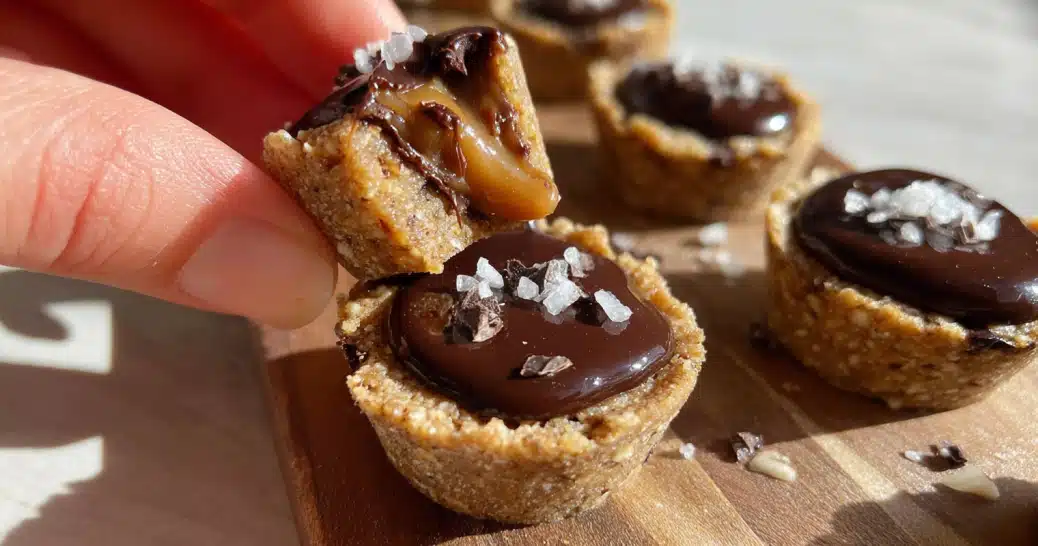 Healthy Twix Cookie Cups on parchment paper