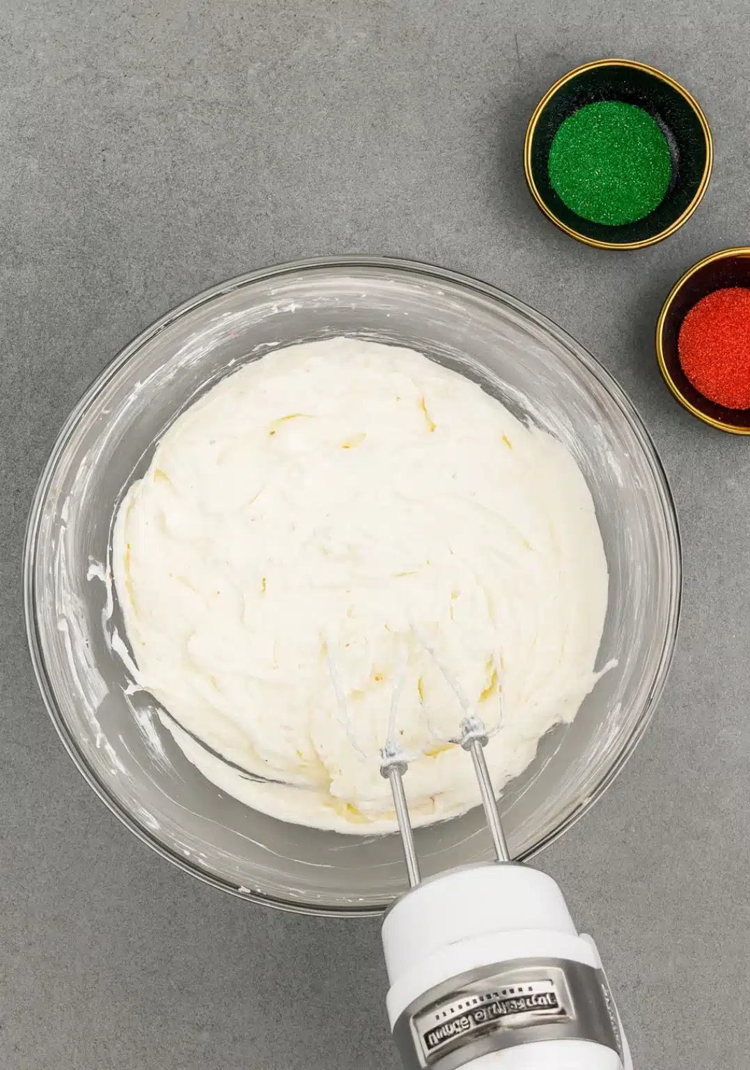 Creamy Little Debbie Christmas Tree Dip mixture after blending in a glass bowl.