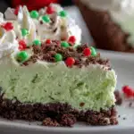 No Bake Grinch Christmas Cheesecake Recipe That Everyone Will Love 3 no bake grinch christmas cheesecake with red heart candy
