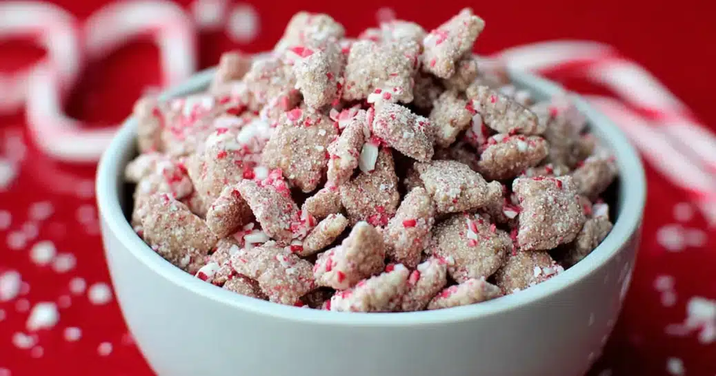peppermint bark puppy chow in a festive holiday bowl