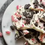 Glossy Peppermint Oreo White Chocolate Bark on parchment paper