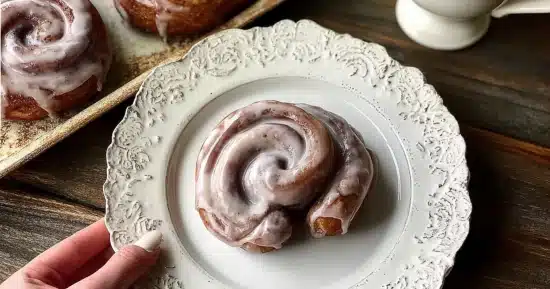 sweet-potato-cinnamon-roll-donuts Sweet potato cinnamon roll donuts glazed with maple cream cheese on vintage white plate