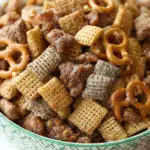 Toffee Chex Mix: The Best Crunchy Sweet and Salty Snack Ever 3 Toffee Chex Mix in a bowl with crunchy pretzels and peanuts