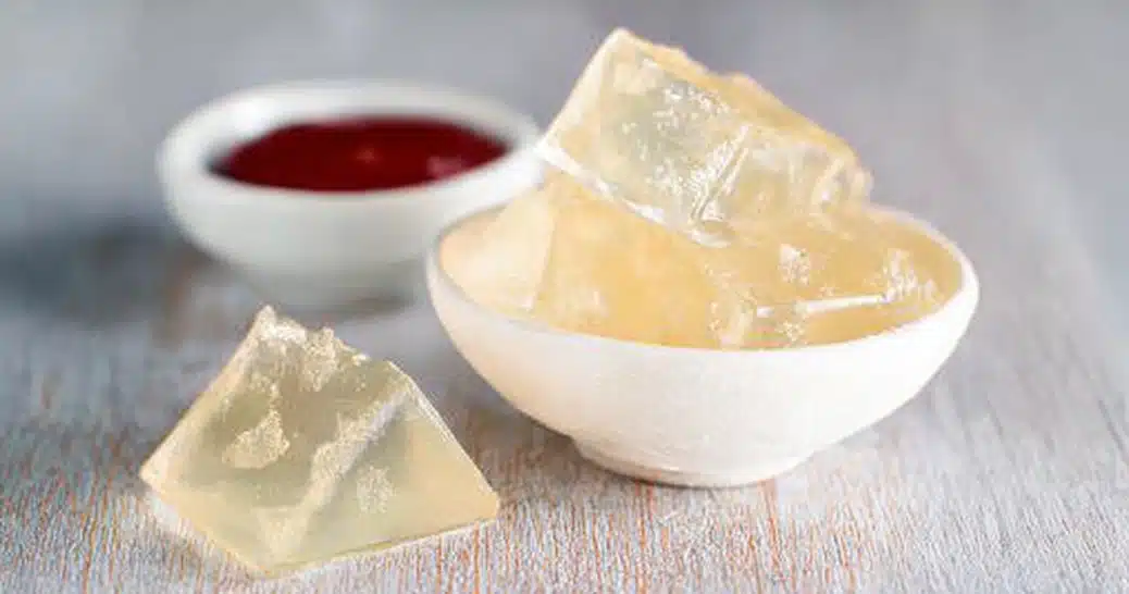 Types of gelatin set into cubes in a white bowl