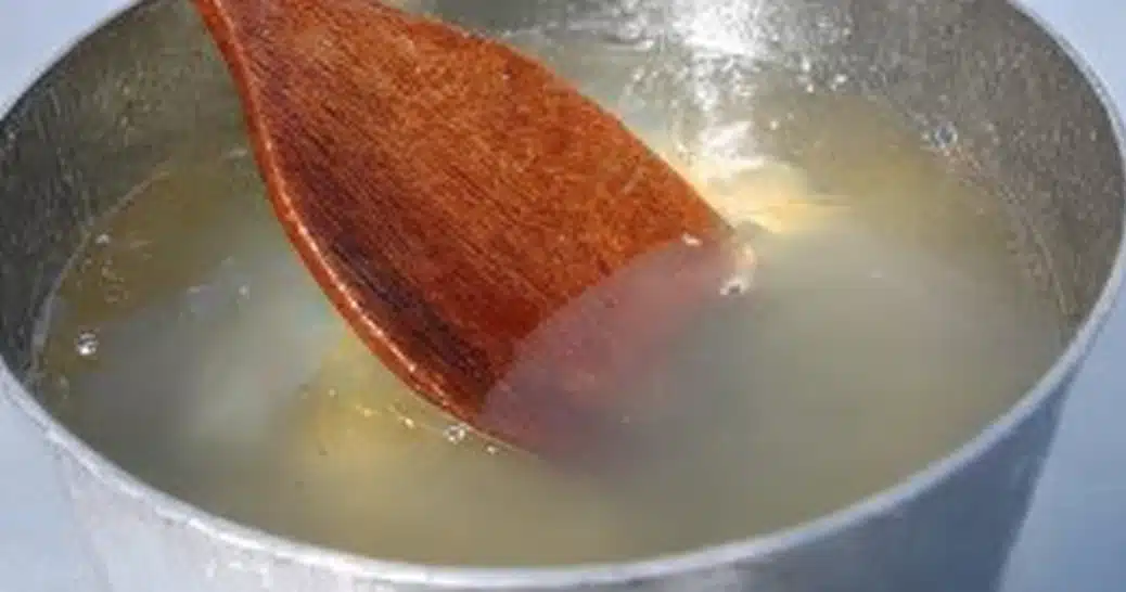 Types of gelatin dissolved in hot liquid with wooden spoon