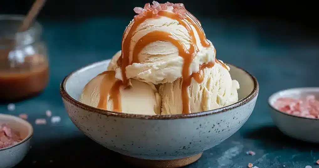 vanilla-ice-cream-pink-salt-caramel-sauce. Vanilla ice cream with pink salt caramel sauce and pink salt flakes