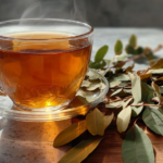 Senna tea in a glass cup with dried senna leaves