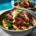 Grilled steak bowl with smoky zucchini and herb sauce, served in a bowl.